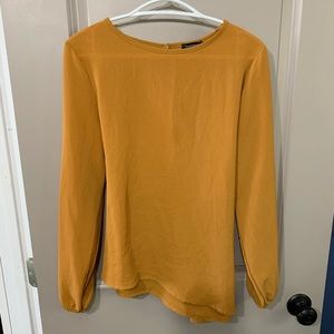 Ladies blouse with detailed back.